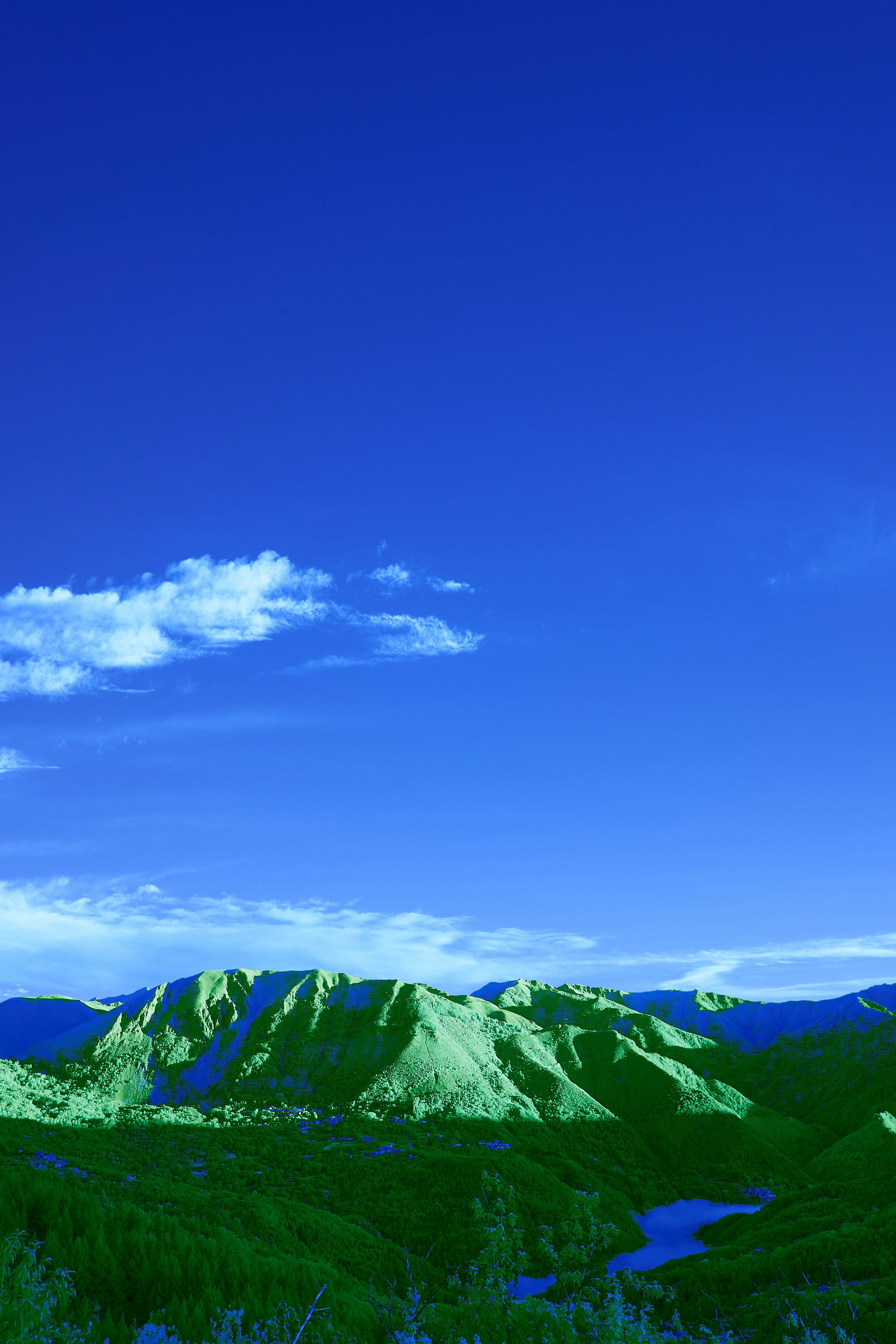 green mountains under blue sky during daytime